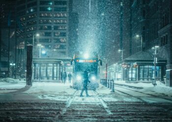person standing in front of a train