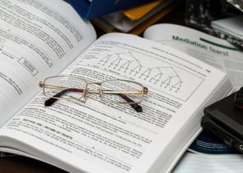 eyeglasses on an opened book