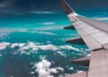 airplane wing above clouds