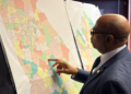 Georgia Representative Mack Jackson, D-Sandersville, examines a map of proposed state House districts ahead of a House hearing on November 29, 2023, at the state Capitol in Atlanta. (AP Photo/Jeff Amy, File) Drew Angerer / Drew Angerer