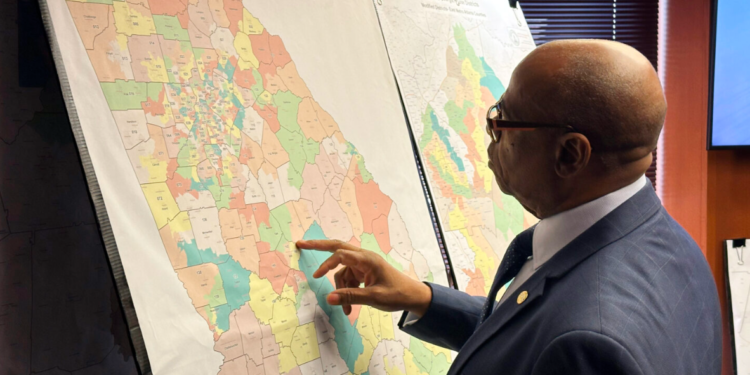 Georgia Representative Mack Jackson, D-Sandersville, examines a map of proposed state House districts ahead of a House hearing on November 29, 2023, at the state Capitol in Atlanta. (AP Photo/Jeff Amy, File) Drew Angerer / Drew Angerer