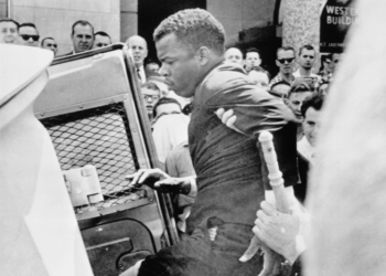 John Lewis, 24, chairman of the SNCC, is escorted into a police wagon during a protest on April 29, 1964. On the same day, Nashville’s mayor announced that U.S. Attorney General Robert Kennedy had initiated an investigation into police brutality against over 200 demonstrators. Photo: Bettmann via Getty Images.