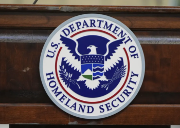 The seal of the Department of Homeland Security is displayed as Homeland Security Secretary Kristi Noem visits U.S. Coast Guard Air Station Kodiak on Monday, March 17, 2025, in Kodiak, Alaska. (AP Photo/Alex Brandon)
