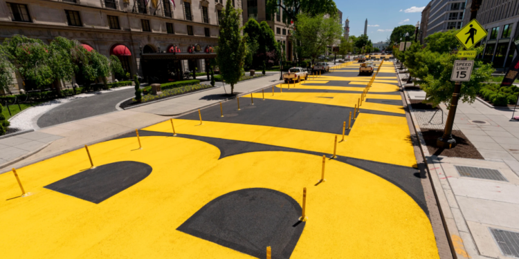 FILE – The "Black Lives Matter" lettering at Black Lives Matter Plaza was repainted after the street near the White House in Washington was resurfaced on May 13, 2021. (AP Photo/Andrew Harnik, file)
