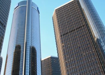 glass high rise building on low angle photography at daytime