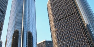 glass high rise building on low angle photography at daytime